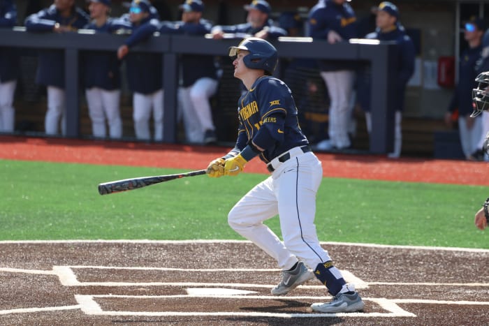 West Virginia senior Reed Chumley watches his first of two home runs against Marshall.